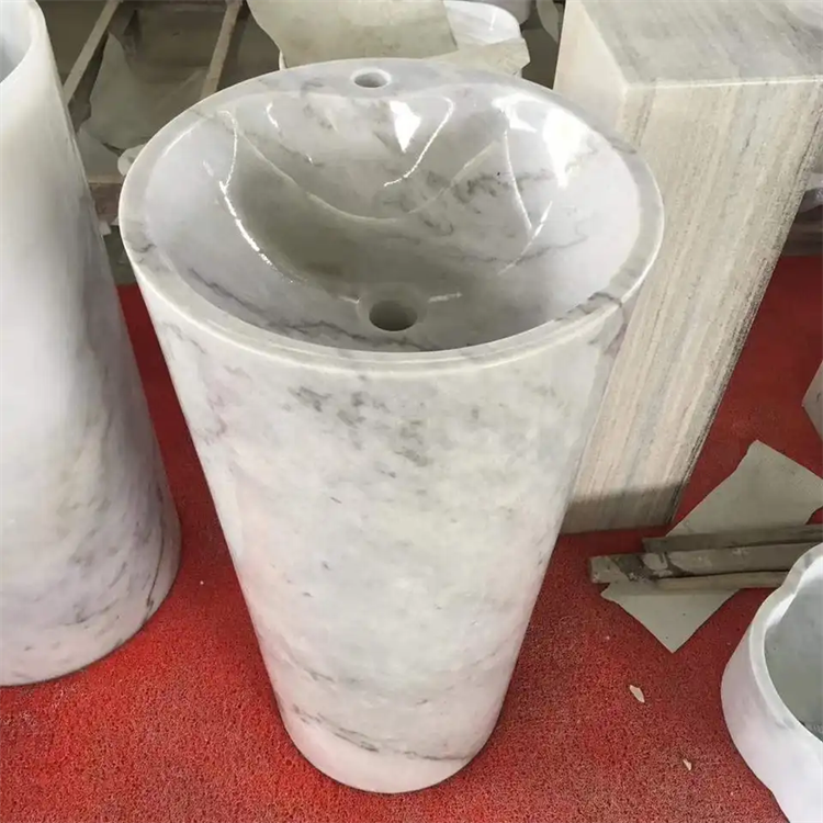 lavabo con pedestal de arte en mármol