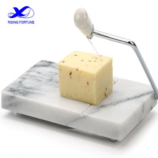 rebanadora de queso de mármol blanco