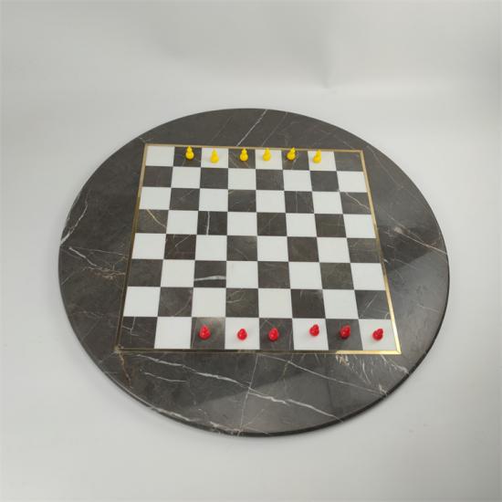 juego de ajedrez redondo de mármol negro
