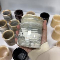 black candle jars with lids and boxes